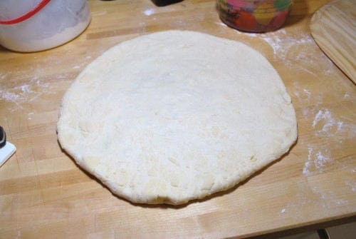 Pizza Round You don't have to get it perfectly round. Imperfection shows it is homemade.