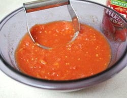 Using a pastry/dough blender I roughly chopped the tomatoes.