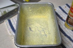 Coat with cornmeal Tap the pan on each side to evenly coat the pan with cornmeal.