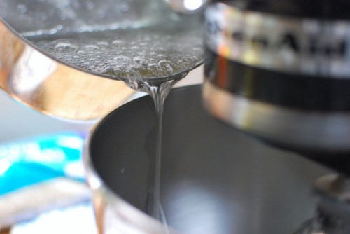 Drizzle the sugar while the mixer is on high Drizzle the sugar while the mixer is on high