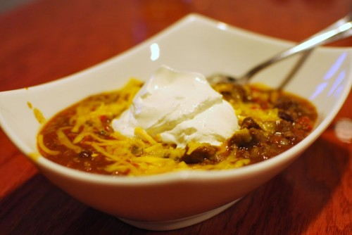 A dollop of sour cream and some cheddar cheese finish up this excellent chili