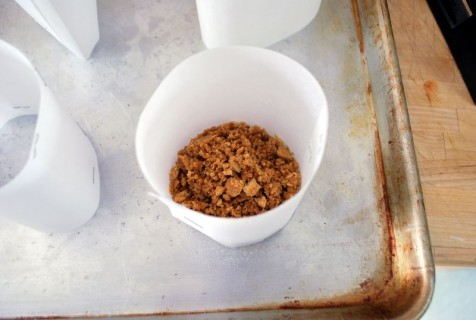 Stamp down the crust with a can or jar Stamp down the crust with a can or jar